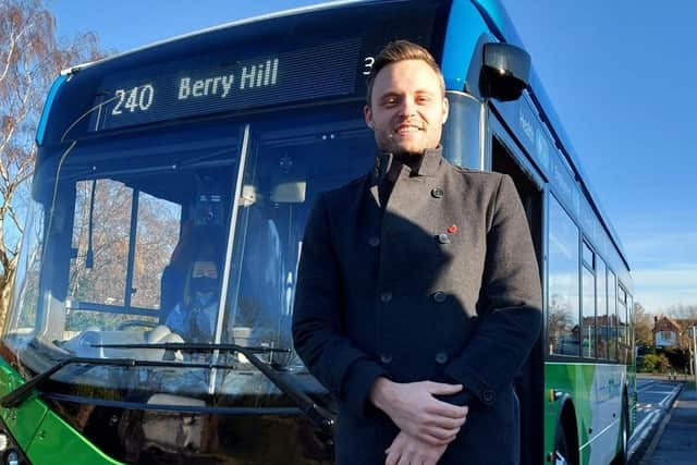 Ben with one of Nottinghamshire County Council's buses