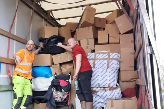 Pictured are Callum Pike  and Stuart Dicks Taylors Transport employees loading the last truck of aid headed ti help the Ukraine refugees.