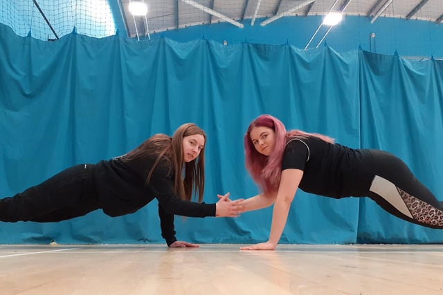 Sports students Mollie Radford and Lauren Bywater limbering up before getting involved in sports exercises.