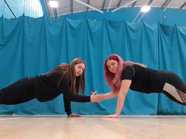 Sports students Mollie Radford and Lauren Bywater limbering up before getting involved in sports exercises.