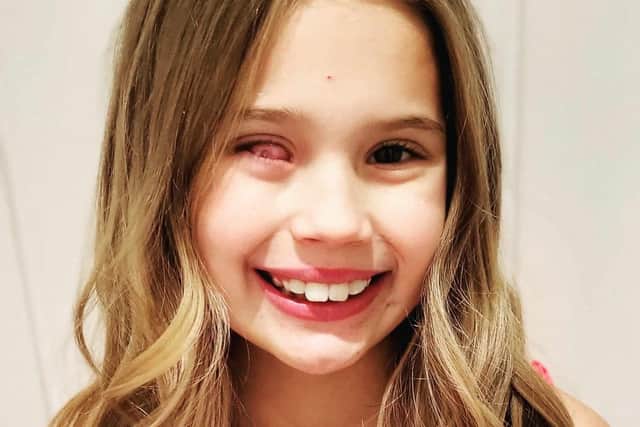 Myah, aged nine, is all smiles.