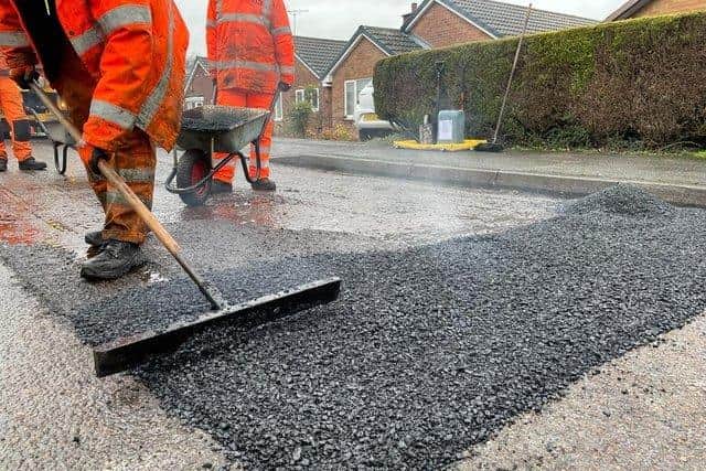 County council workers carrying out repair work on Holbeck Way in Rainworth.