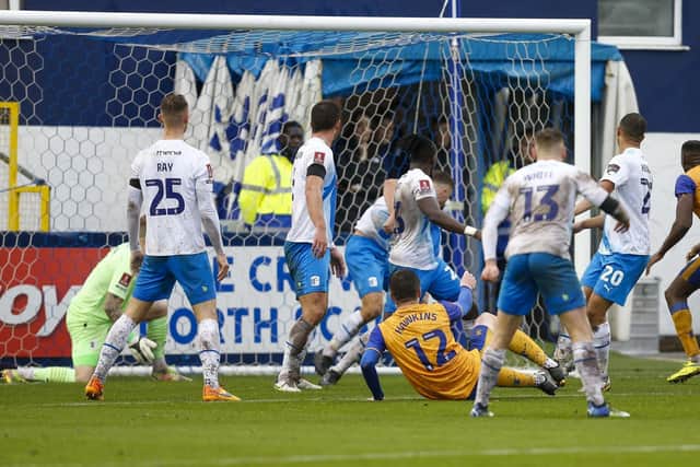 Oli Hawkins scored the only goal to send Mansfield Town through in the FA Cup.