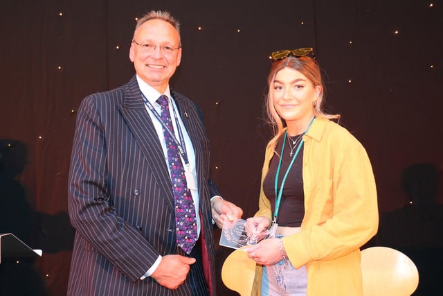 Storm Revely accepts her principal's award from Andrew Cropley