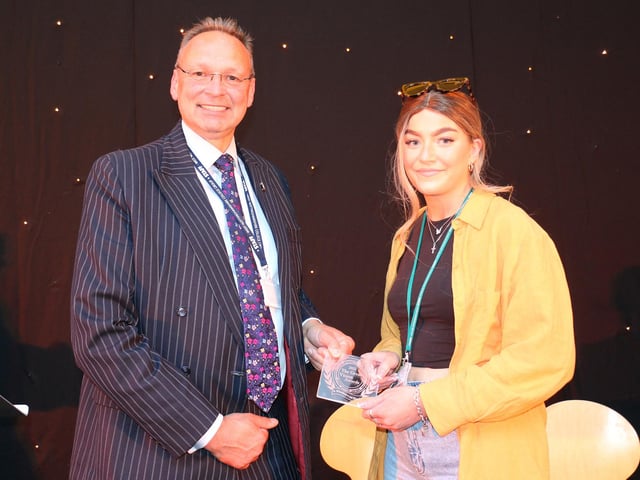 Storm Revely accepts her principal's award from Andrew Cropley