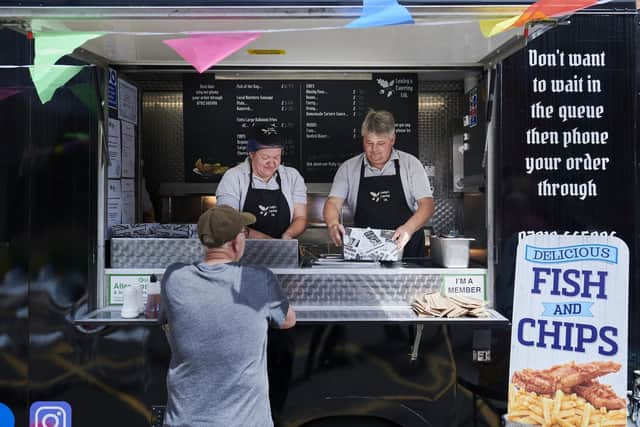 Customers at the mobile chippy.