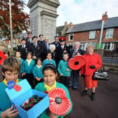 Pupils, Josh Oliver and Yaneek Allen give their support to the Kirkby branch of the Royal British Legion during their launch of the annual poppy appeal in 2012.