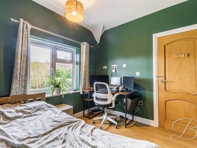 This spacious double features laminate flooring, central heating radiator and a window to the front elevation.