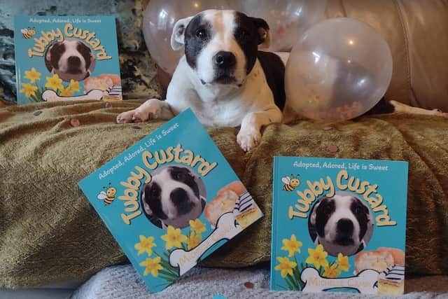 Tubby Custard with copies of his own Michelle Camm's new book all about him. Photo: Submitted