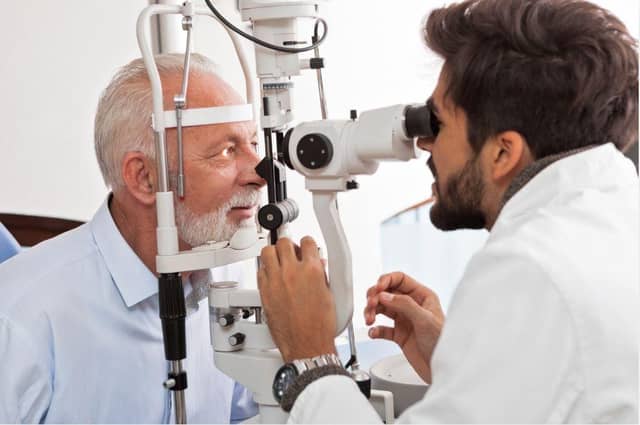 An optometrist doing an eye test