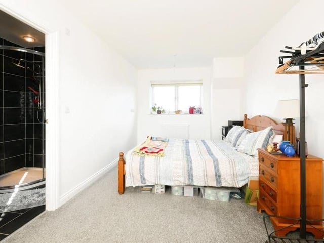 The other two bedrooms sit on the first floor, including this one, which is a good size and boasts a very smart en suite, complete with walk-in shower cubicle.