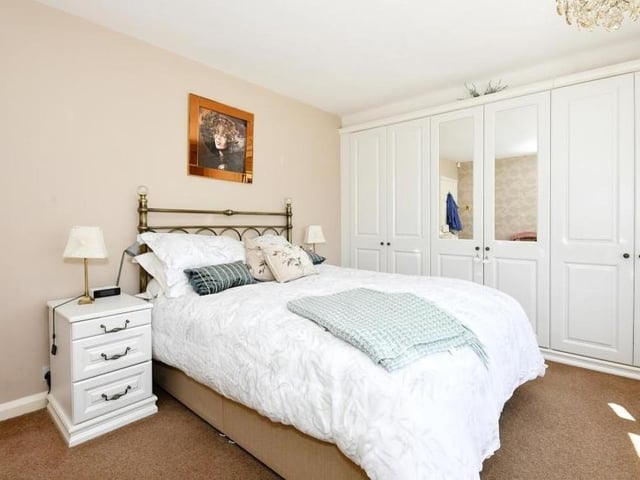 The size of the extensive, fitted wardrobes is underlined in this second photo of the main bedroom at the Chatsworth Drive bungalow.