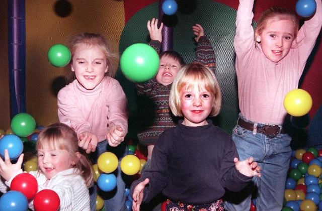Rebecca, Sophie, and Rachel Robinson Right of Kirk Sandall. Playing in a ball pit with their cousins, 1996.