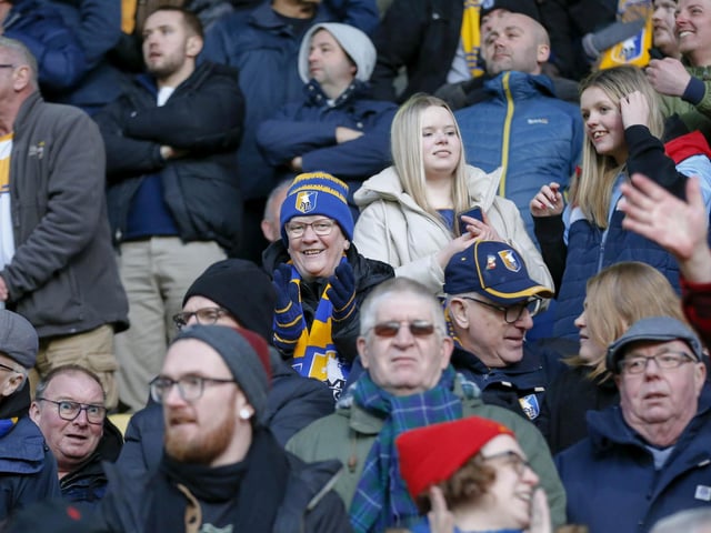 Travelling Stags fans watch the Sky Bet League 2 match against Bradford City.