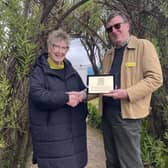 Jennie Street, of Rhubarb farm, receives award from Andrew Young of the National Garden Scheme