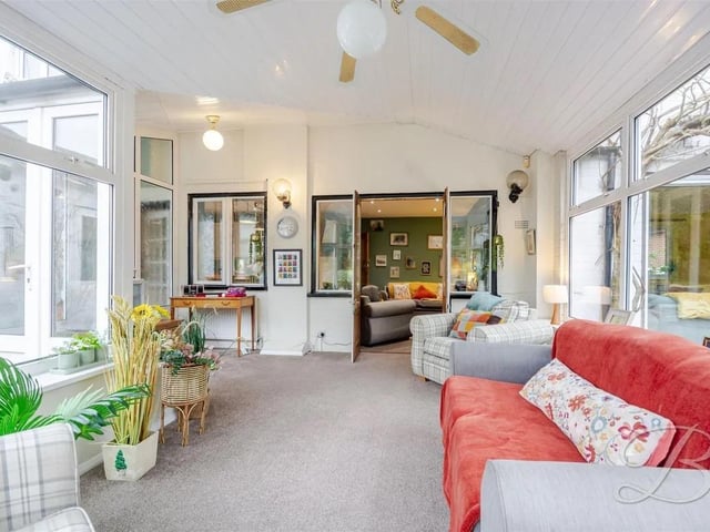 The light and bright conservatory is the perfect place to watch the seasons change