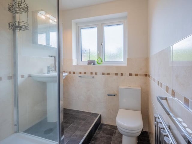 As well as the en suite bathroom to the master bedroom, the Selston property features this family shower room.
