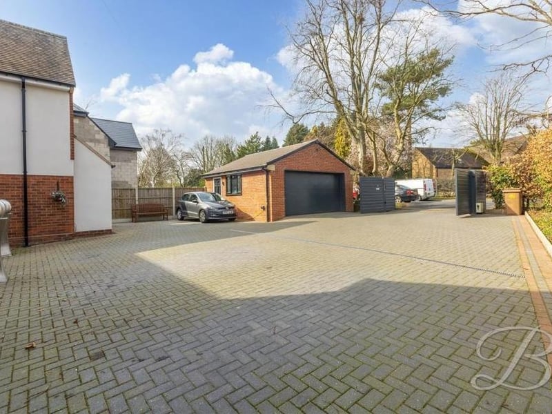 The driveway at the front also leads to this detached, brick-built garage.