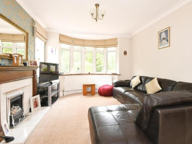 Also off the hallway is this substantial lounge or living room, which also extends to form a dining room. A bay window and feature fireplace make it bright, warm and welcoming.
