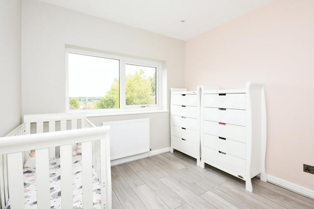 This bedroom is currently being used for a young child. It has plenty of space for storage.
