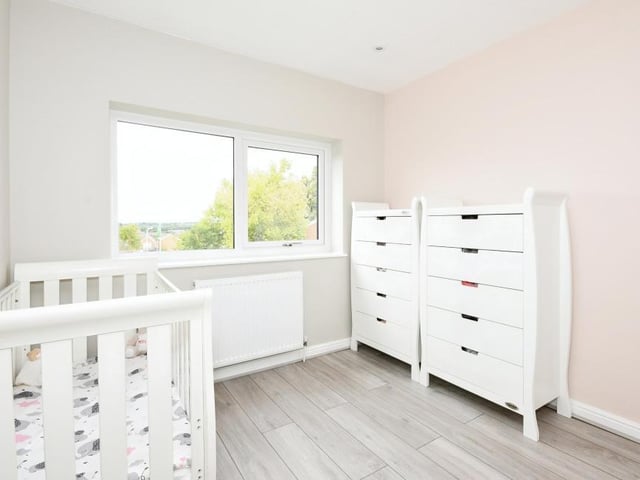 This bedroom is currently being used for a young child. It has plenty of space for storage.