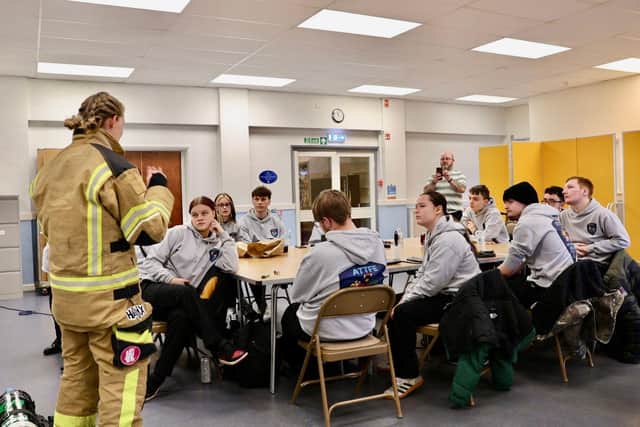 Fire Walk 2026 -NFRS Crew Manager Lou Needham discussed the challenge with ATTFE College Uniformed Service learners.