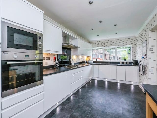 A second look at the kitchen, where more integrated appliances include a fridge freezer and an eye-level electric oven and microwave. Other assets include spot lighting, a window overlooking the back garden and an inset one-and-a-quarter Astracast sink and drainer with mixer tap over.