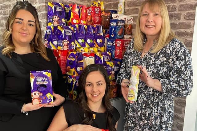 Salon owner Hayley Wood shows off some of the Easter eggs collected so far, with staff member Beth McLane (left) and salon manager Alanya Jennings (centre)