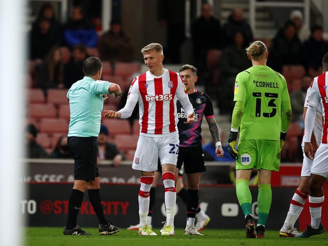 Sam Surridge of Stoke City argues with players from Peterborough United which resulted in a red card. It is one of four reds for Stoke this season.