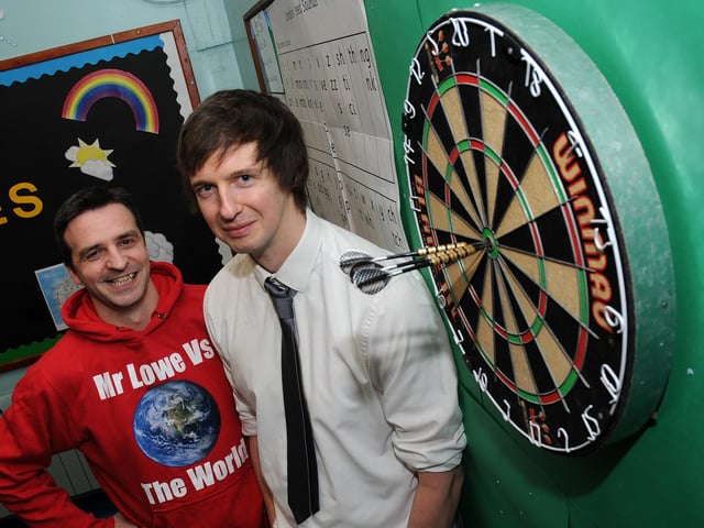 Steve Lowe, of Kingfisher Primary School, took on Free Press reporter Paul Goodwin in a darts match to raise money for Sport Relief in 2014