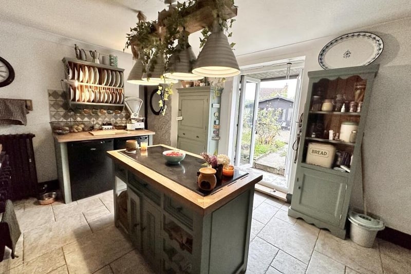 The bespoke kitchen also has access to the cottage's delightful garden.