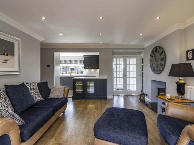 This photo shows how the sitting room also provides easy access to the kitchen.