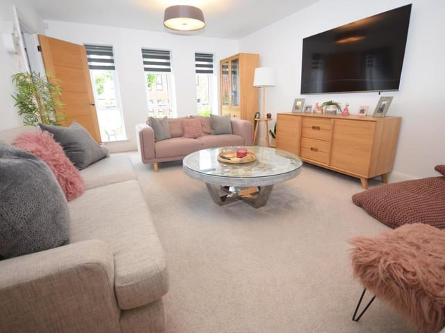 The lounge features three full-height uPVC windows at the front of the property which work together to create a fabulous sense of space and light. Visually, they are dramatic, both inside and out.