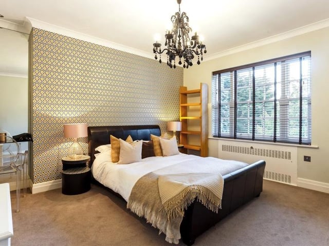 Oozing elegance, here is another double bedroom. Of the five in total, one of them is split, with half devoted to a games room, while another is currently being used as a dressing area with full-height wardrobes and fitted shelves. The two smaller bedrooms overlook the front of the Roebuck Drive house.
