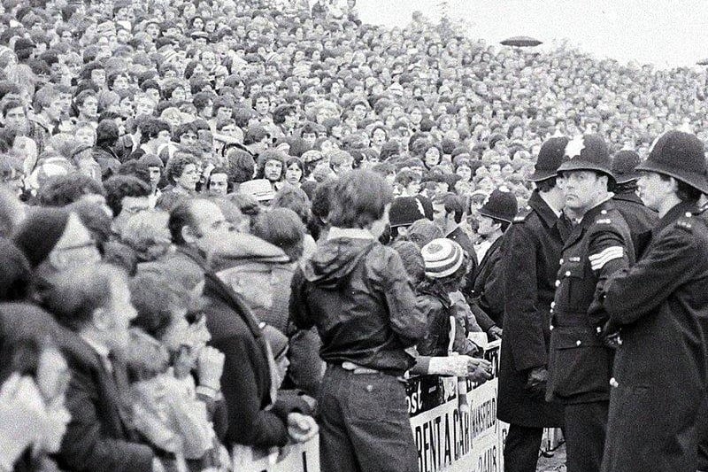 Police watch fans at Stags v Sheffield United in 1977.