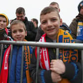 Fans await the arrival of the teams before the FA Cup Third Round match between Mansfield Town and Liverpool at One Call Stadium on January 6, 2013.