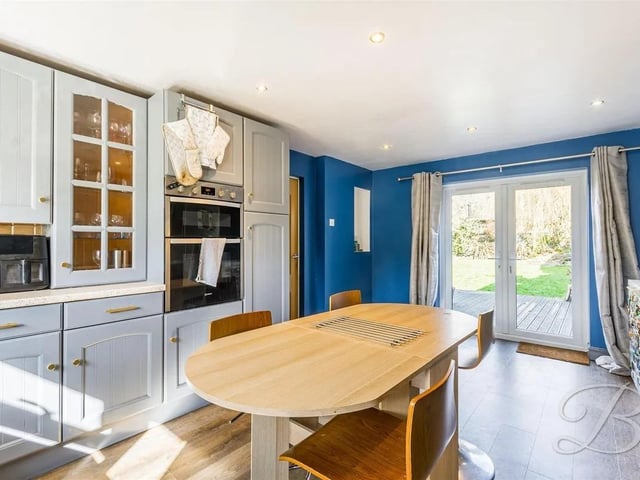 The kitchen is well-equipped and complemented by patio doors opening to the rear garden giving an abundance of natural light.
