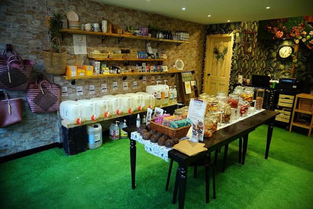 The shop stocks food cupboard staples and cleaning products alongside local suppliers' wares.