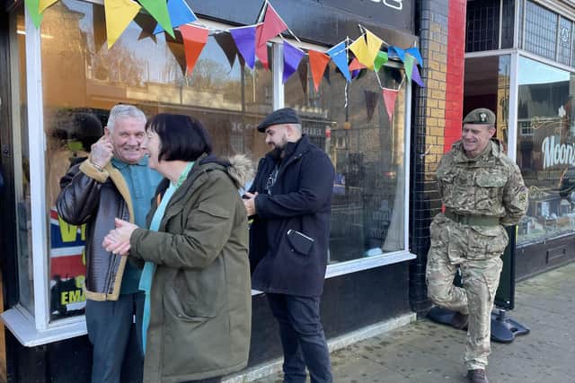Eileen enjoying a laugh on the opening day of the shop with Cllr Sid Walker (left) and Sgt Gordon Hardy, of Mansfield's Army Reserve Centre (right)