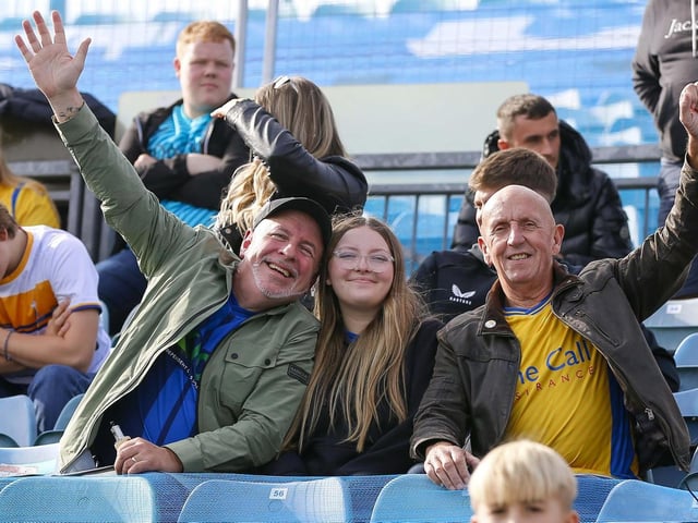 Mansfield Town fans watch the 1-1 draw at Gillingham.