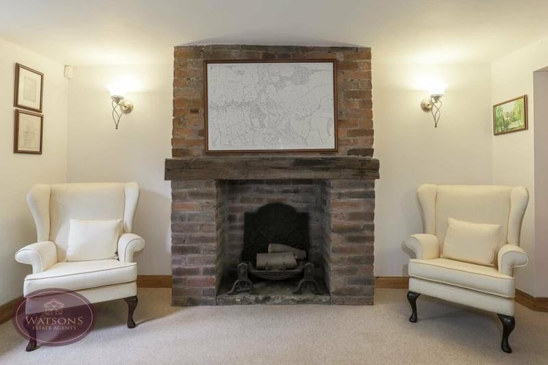 A close up of the feature fireplace in the sitting room, which is an inglenook type,with inset space for a fire.