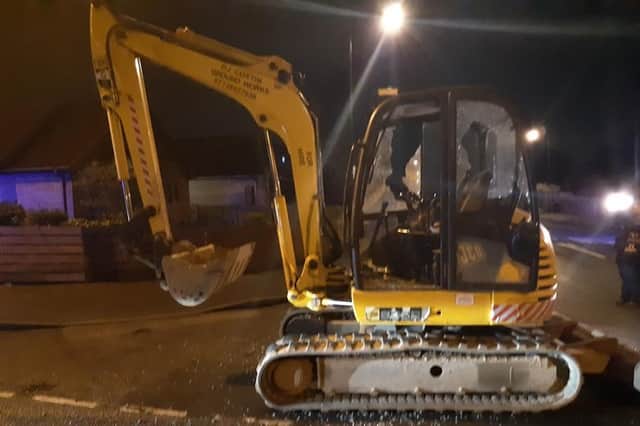 A man, 35, was arrested in Nottinghamshire after a 3mph police chase involving this digger (pic: Nottinghamshire Police)