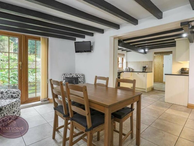 As you can see, there is plenty of space in the dining kitchen for a breakfast or dining table.It sits next to French doors that lead out to the back garden
