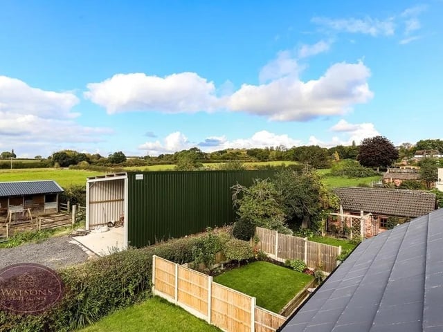 The 2 tiered rear garden comprises of Indian stone paved patio area, with steps leading to the second tier with turfed lawn. The rear garden is enclosed by hedges and timber fences to the perimeter and benefits from open views to the farmland behind.