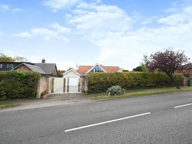The last image in our gallery shows how the Lichfield Lane property presents itself from the road. Behind the gates is off-street parking space for several vehicles.