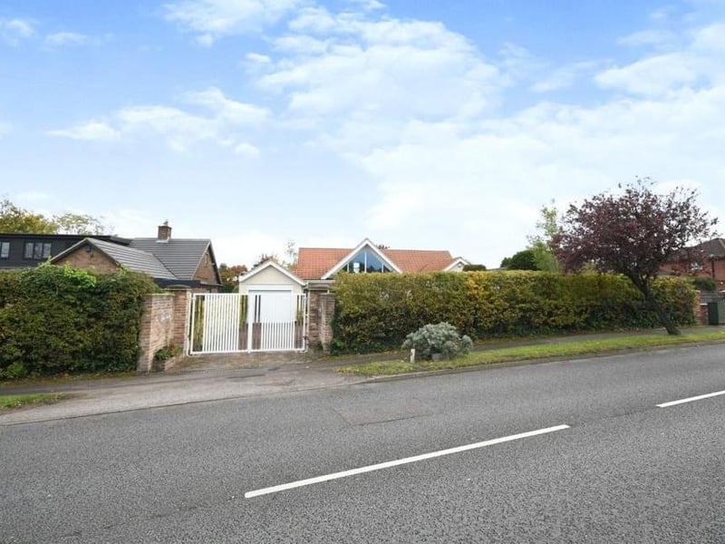 The last image in our gallery shows how the Lichfield Lane property presents itself from the road. Behind the gates is off-street parking space for several vehicles.