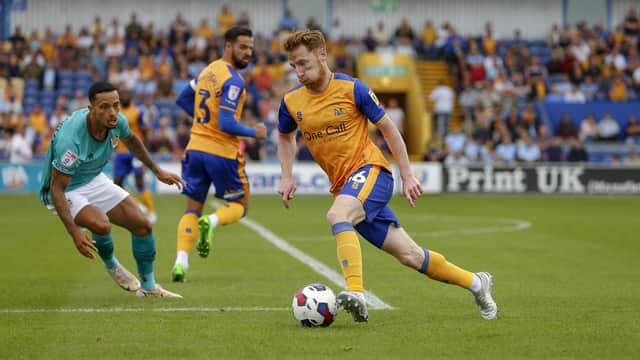 Mansfield Town midfielder Stephen Quinn keeps possession during the Sky Bet League 2 match against Tranmere Rovers FC at the One Call Stadium. Pic: Chris Holloway / The Bigger Picture.media