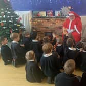 Father Christmas read the children a story