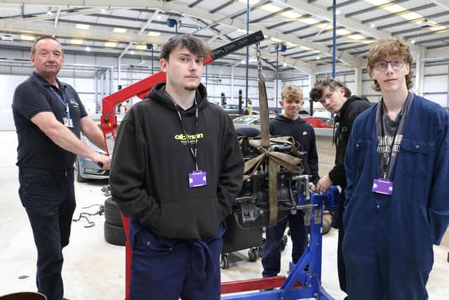 Level 3 students working on an engine for their final assessments