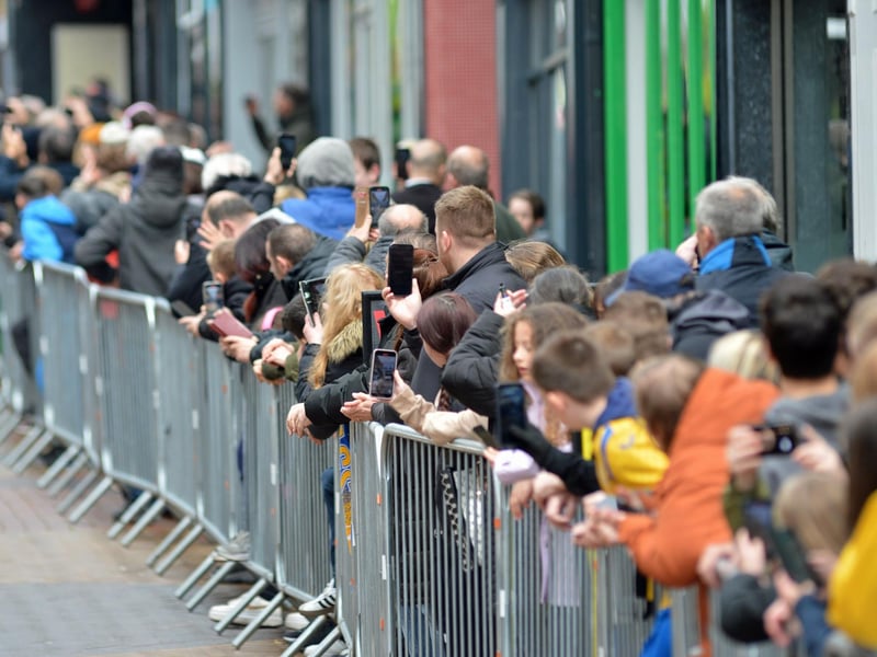 Fans line the street.